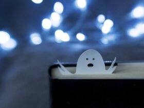 A black book with a ghost bookmark.